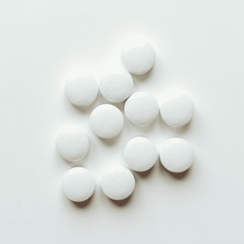 White supplement tablets